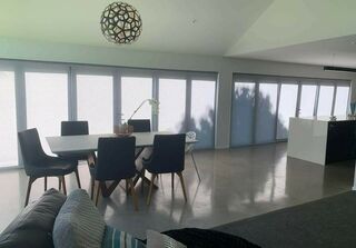 Battery powered motorised roller blinds for whole open areas of Kitchen, dining room and family room