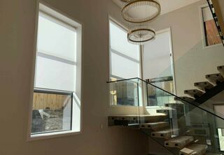 Motorised Roller Blinds for the stairway high window
