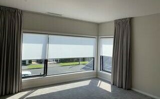 Combining  the L shape 90 degree Curved motorised curtain and motorised Light Filtering Roller Blinds 