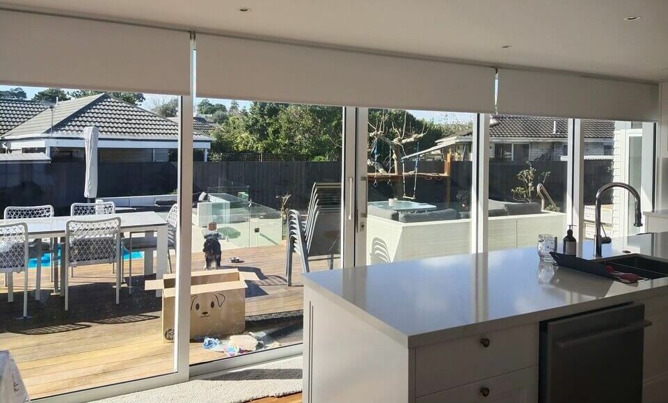 Three of Li-ion battery powered motorised blackout roller blinds
